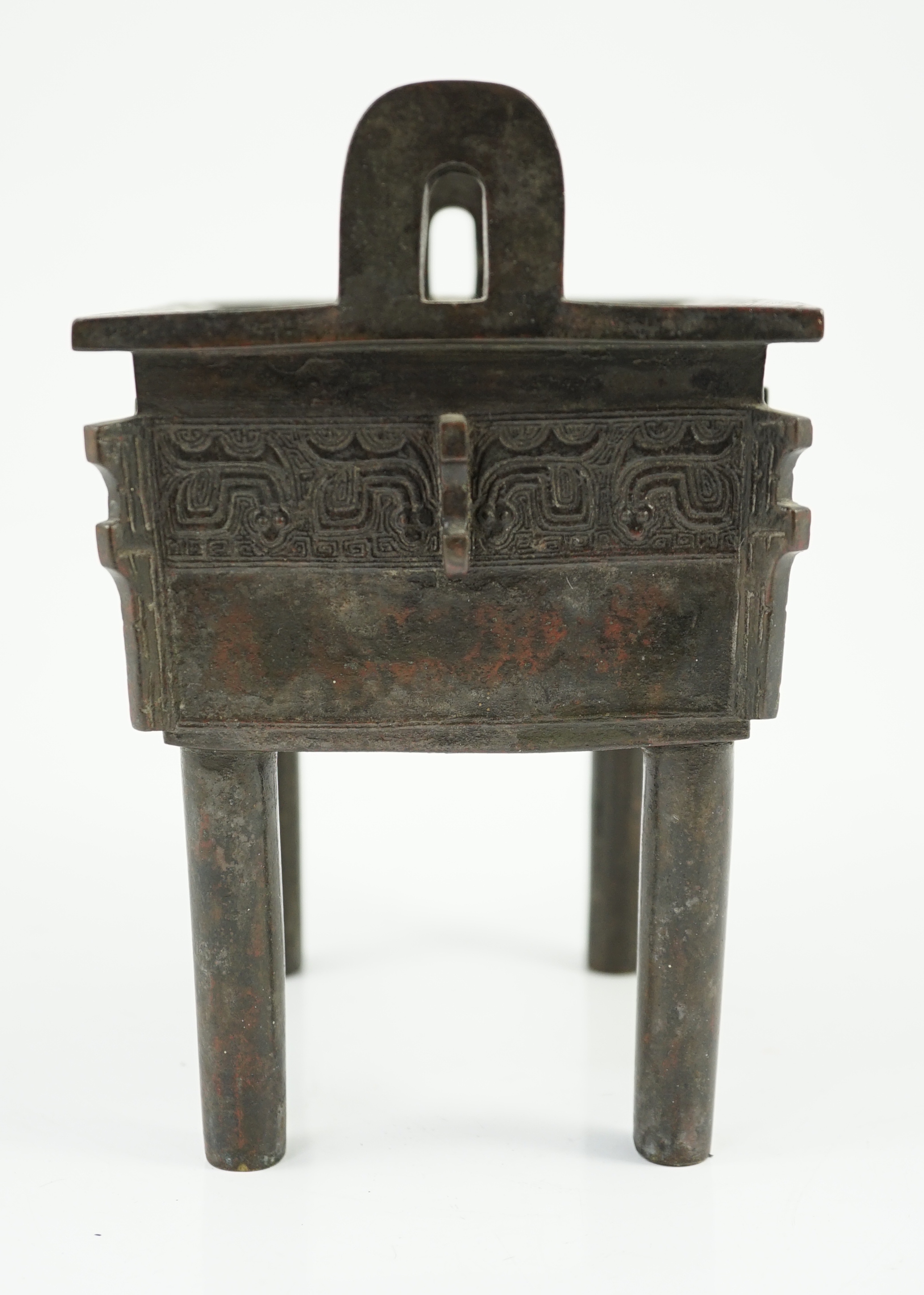 A Chinese archaistic bronze vessel, fangding, 17th/18th century, old repair to one leg